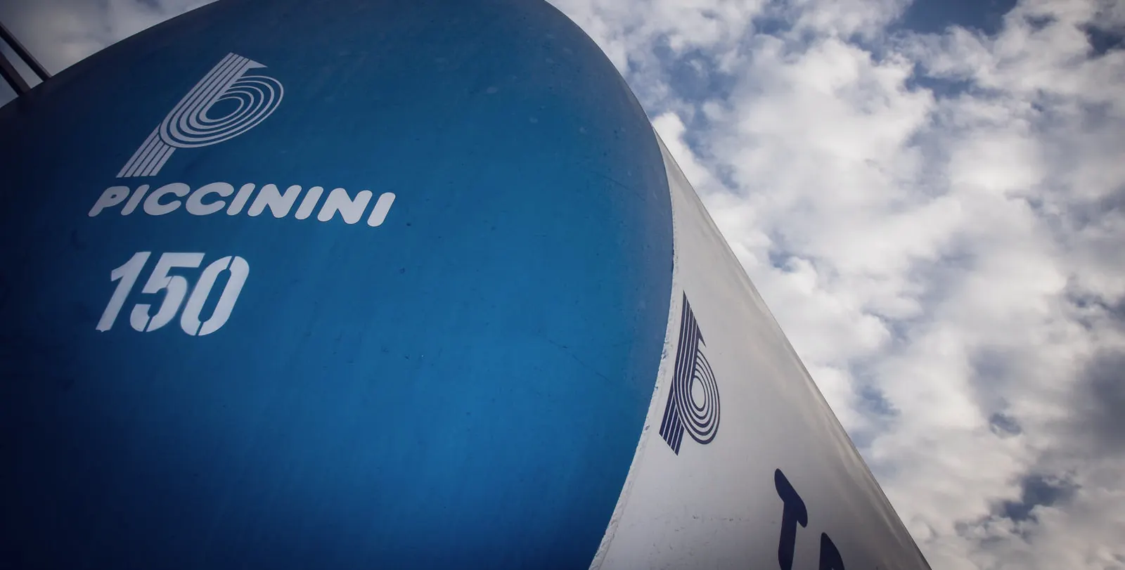 Side of a Piccinini silo trailer against the sky